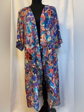 LuluRoe "Shirley" Kimono
Vibrant multicolored, geometric, print. Size M